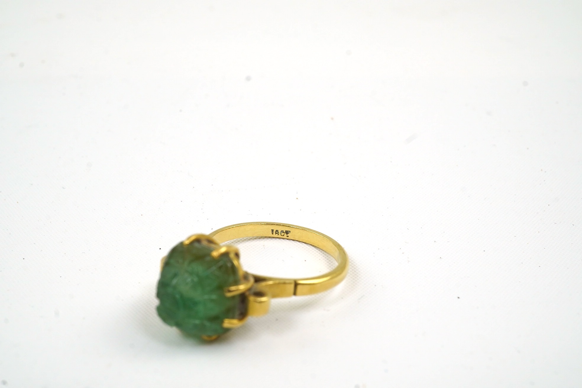 A mid 20th century 18ct gold and single stone emerald set ring